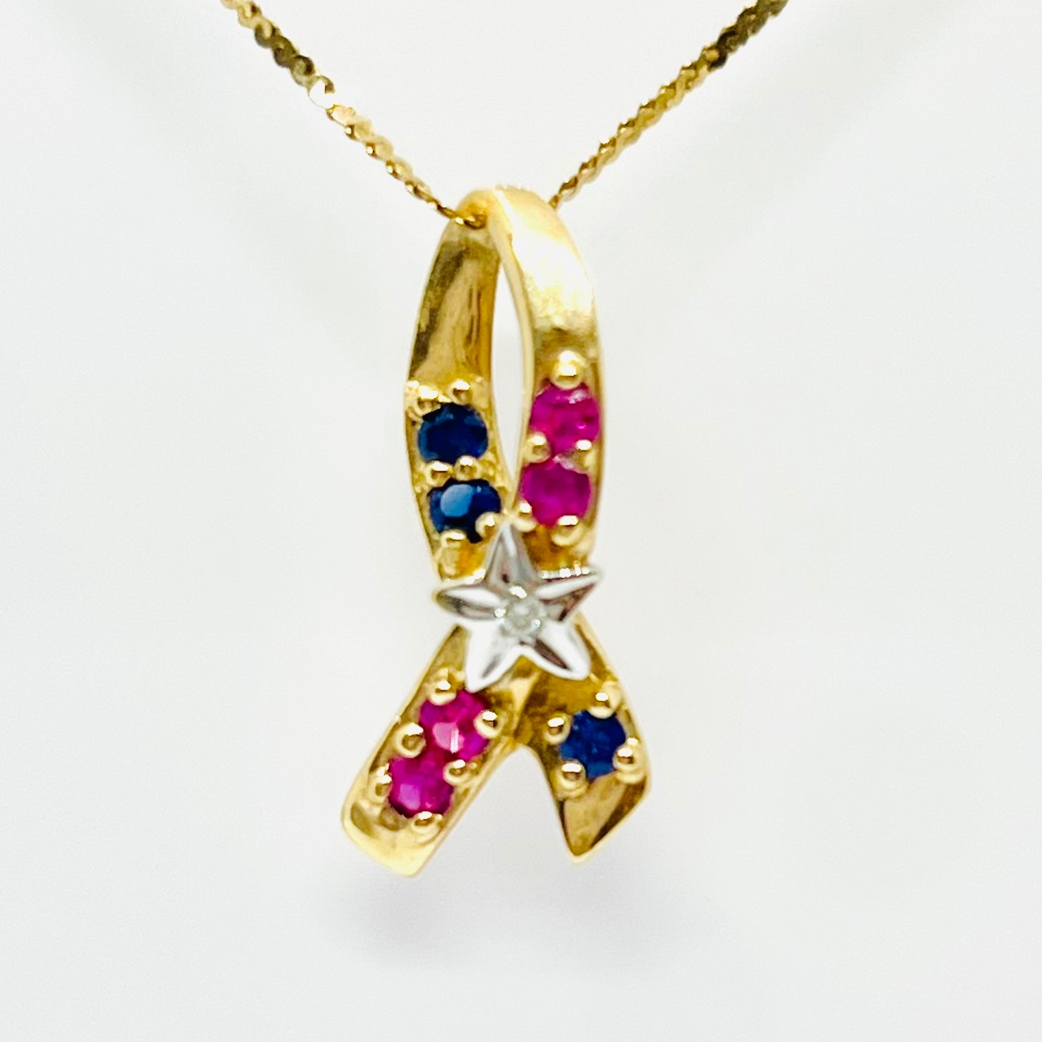 10K Ruby Star Ribbon Pendant
